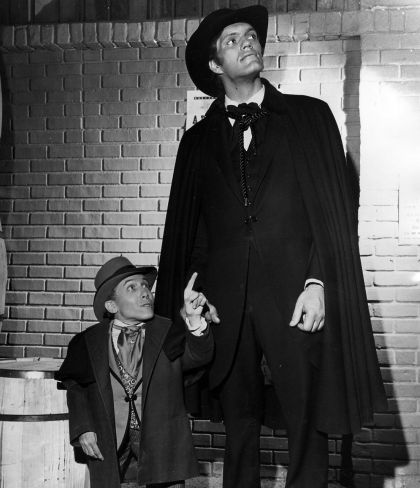 Two Uranian Body Types: Michael Dunn with Dwarfism and Richard Kiel with Giantism, both exotic abnormalities which in the Michael Teachings make them both striking and instill some discomfort for people. 